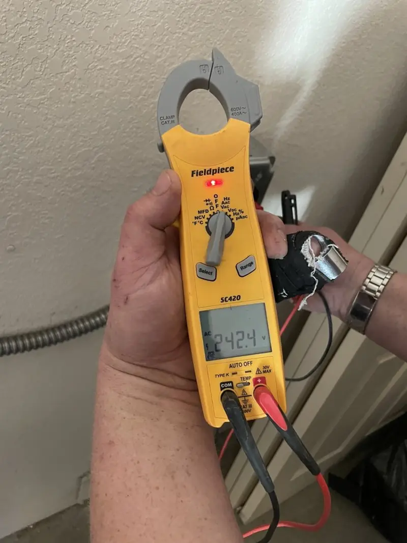 Voltage testing with clamp meter during Circuit Breaker Repair in Lovington